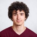 close-up-portrait-curly-handsome-european-male-768x512